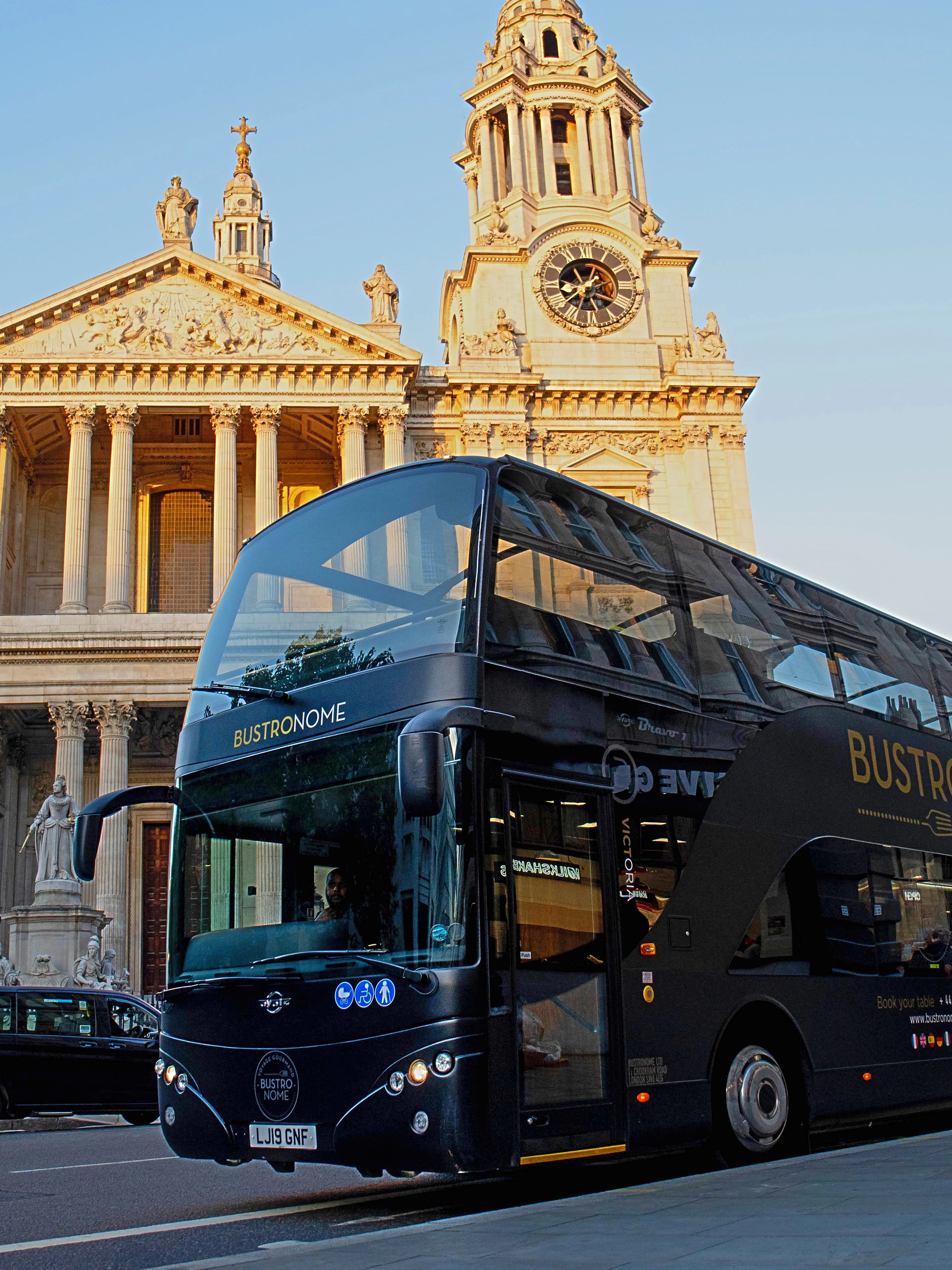 Bustronome tour bus in front of St. Paul's Cathedral, London.