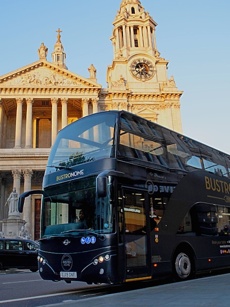 Bustronome tour bus in front of St. Paul's Cathedral, London.