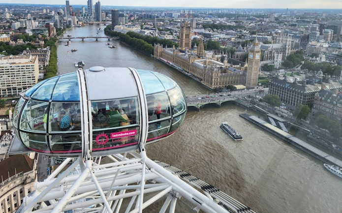 London Eye capsule overlooking the Thames and Houses of Parliament.