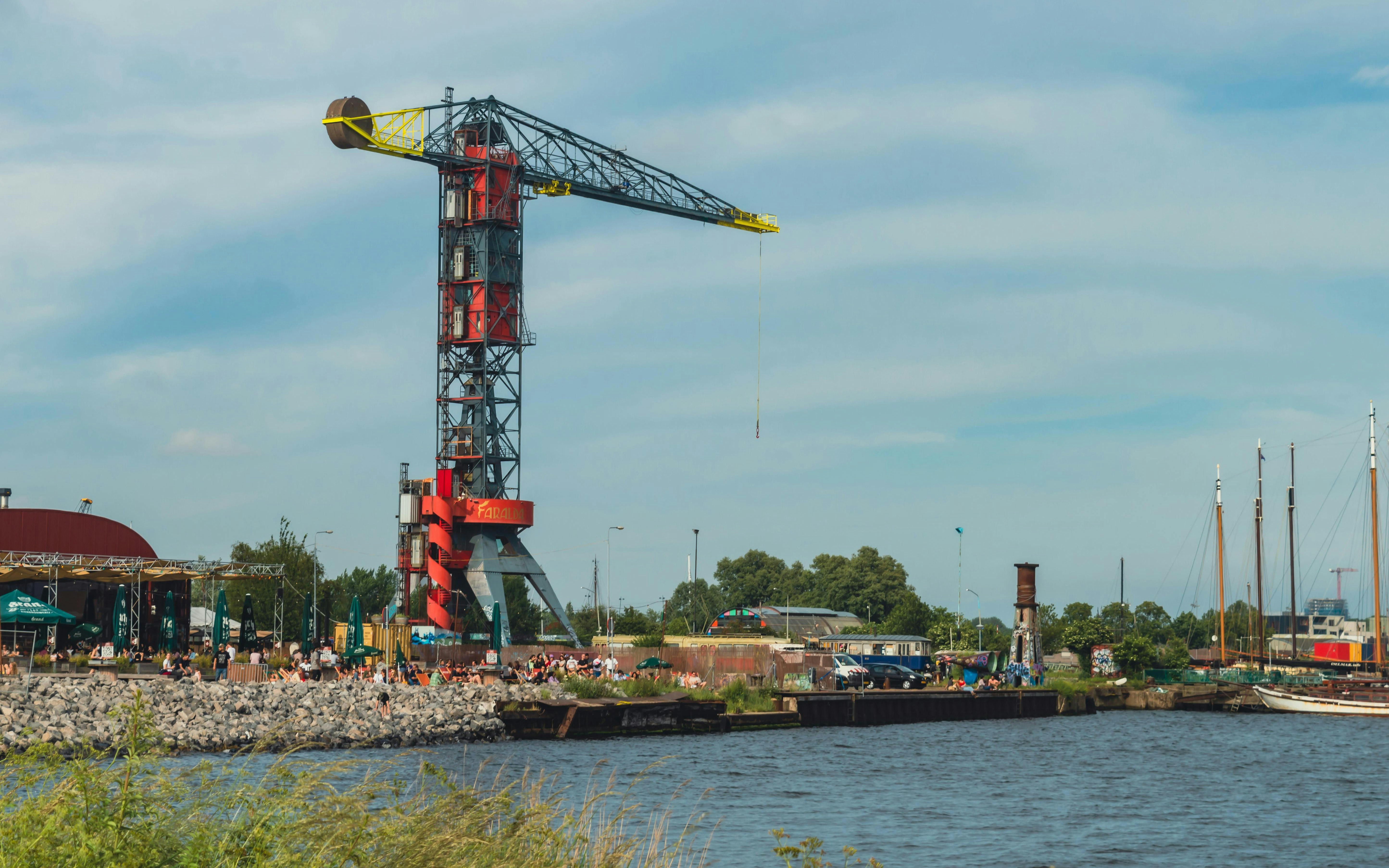Colorful crane on NDSM island by the waterfront in Amsterdam.