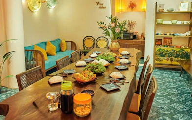 Traditional Vietnamese cooking class setup with dishes and ingredients on a wooden table.