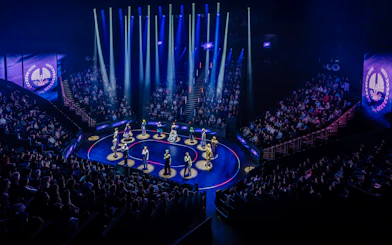 Hunger Games West End show stage performance with actors in spotlight.