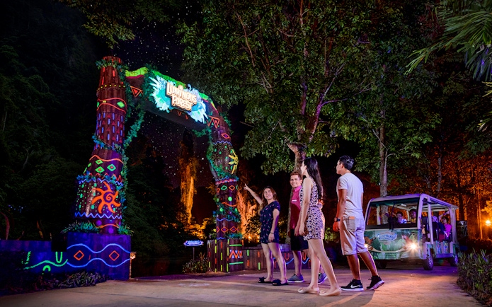 Visitors entering Luminous Forest at Lost World Hot Springs Night Park.