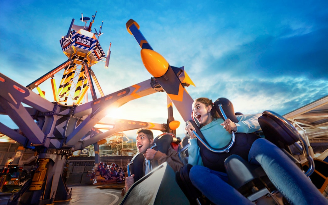 People enjoying a thrilling ride at Genting SkyWorld Outdoor Theme Park.