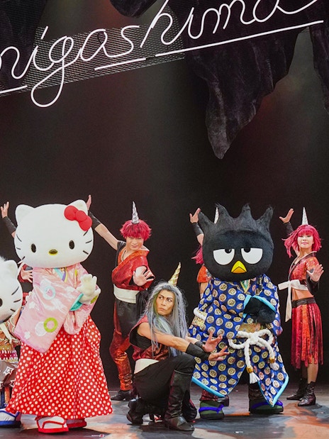 Sanrio characters performing on stage at Sanrio Puroland, Japan.