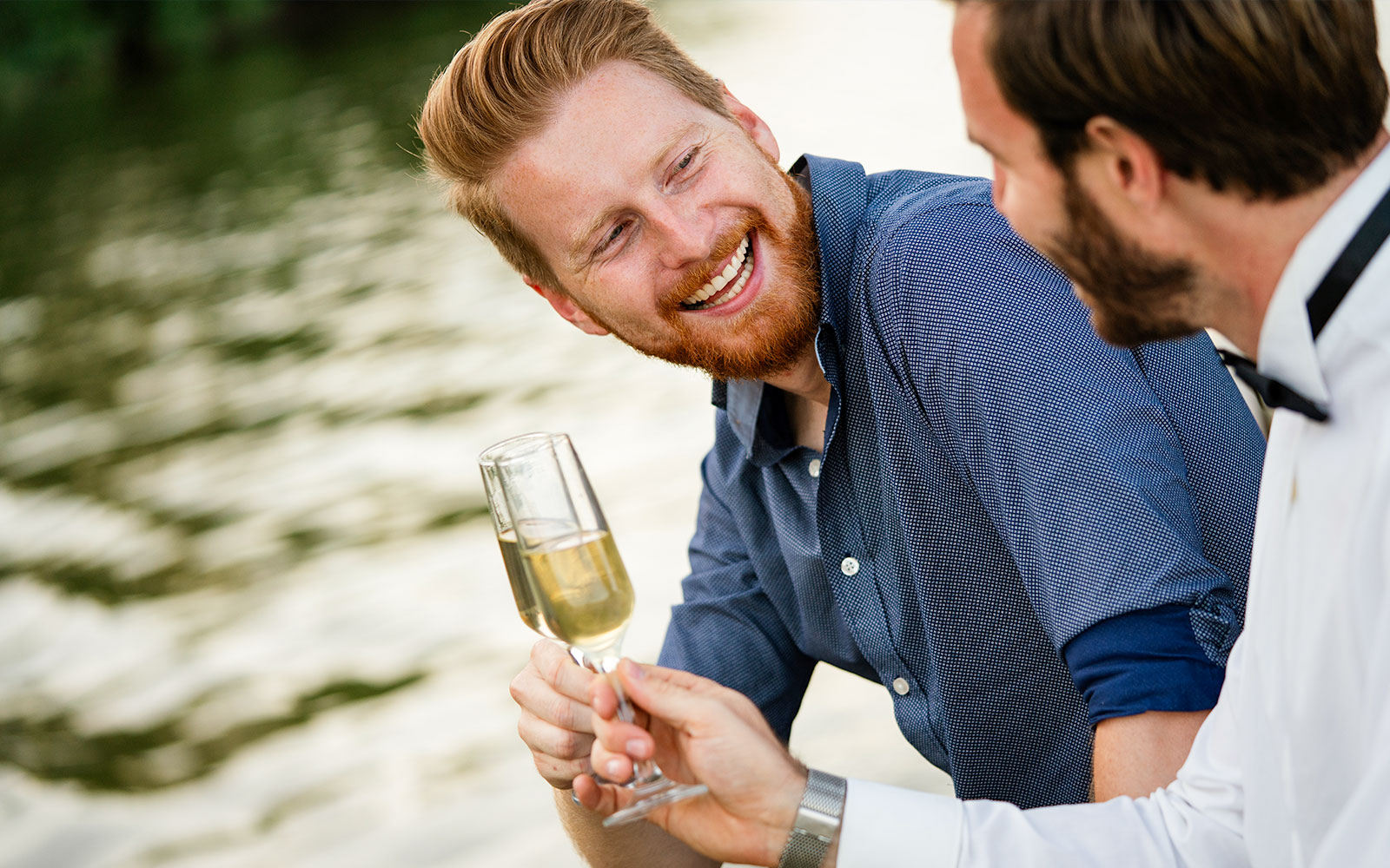Two people enjoying champagne on the Bateaux Mouches Seine River dinner cruise.