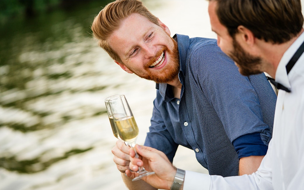Two people enjoying champagne on the Bateaux Mouches Seine River dinner cruise.