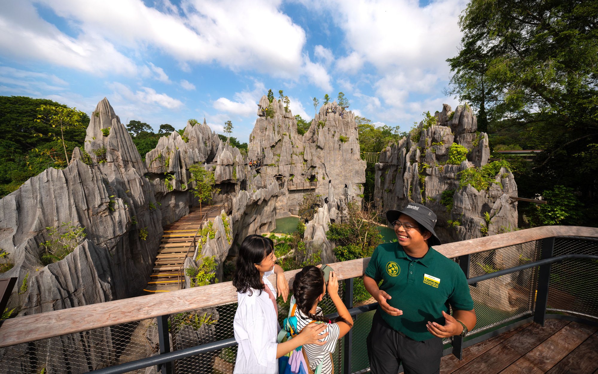Ranger discussing rainforest features with visitors at Rainforest Wild Adventure.
