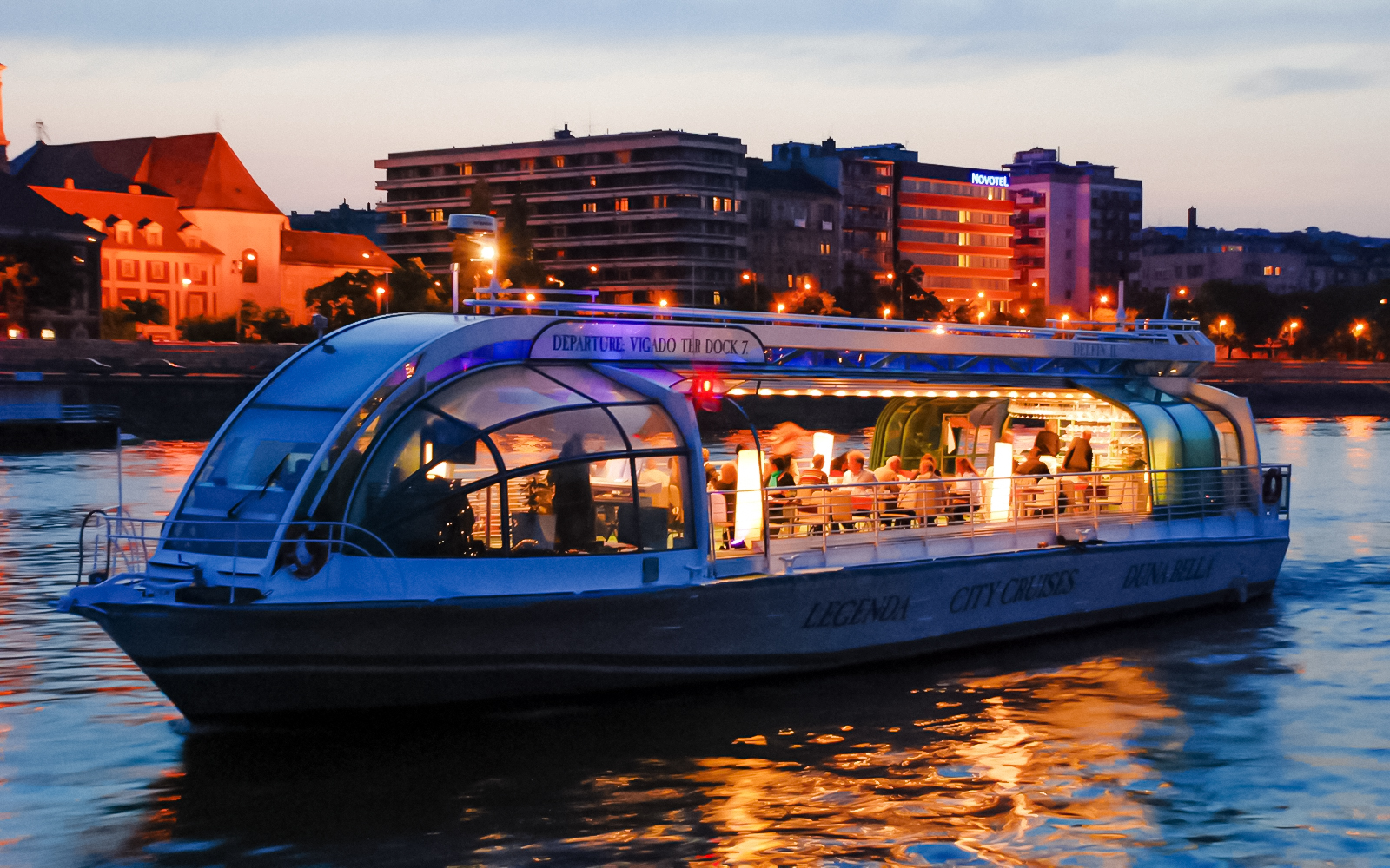 Candlelit dinner cruise on the Danube River in Budapest at sunset.