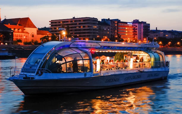 Candlelit dinner cruise on the Danube River in Budapest at sunset.
