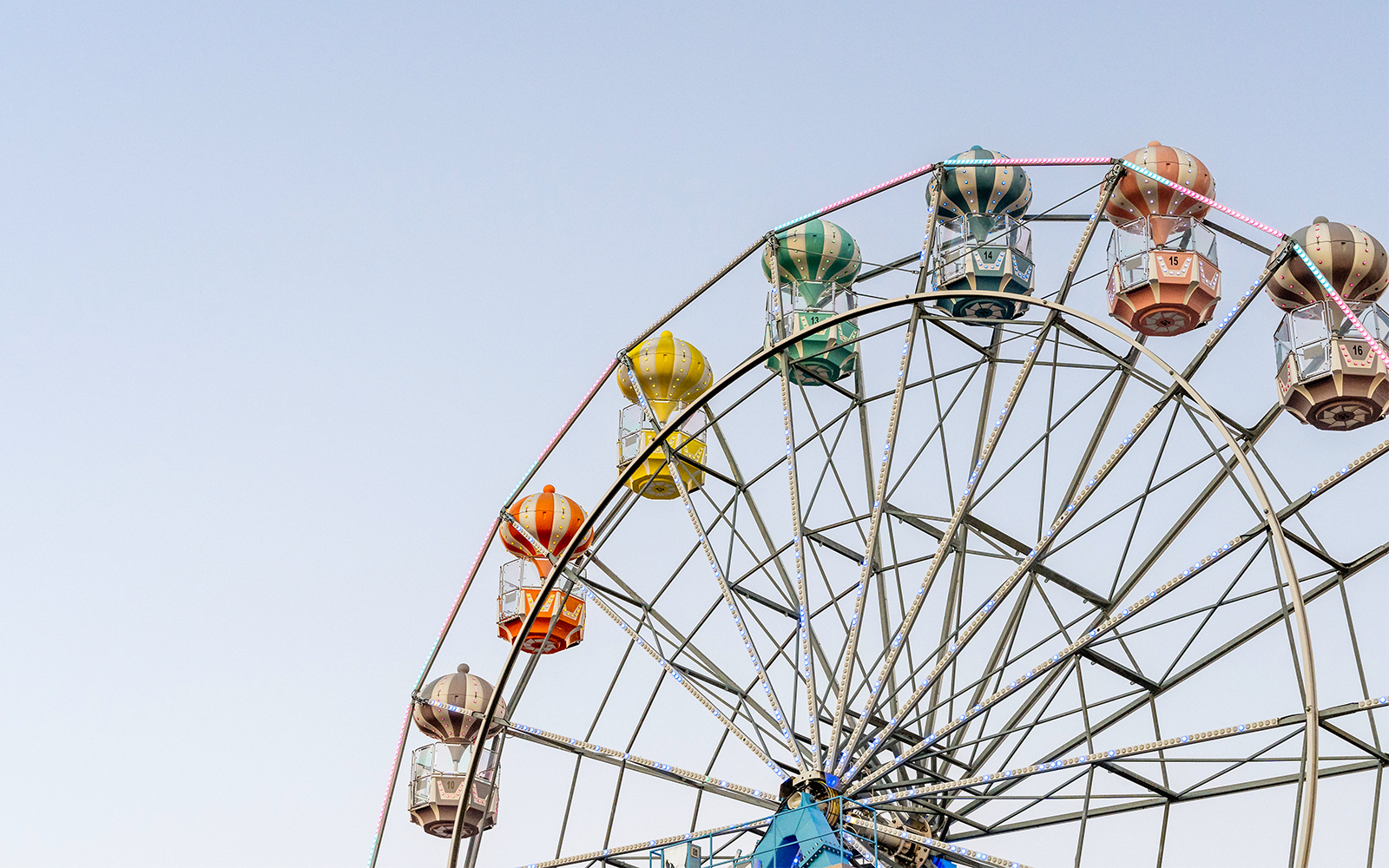 Ferris wheel with colorful gondolas at Old Town, Orlando.