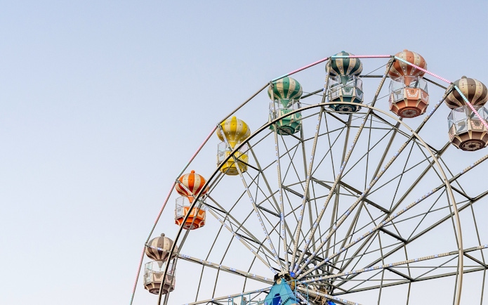 Ferris wheel with colorful gondolas at Old Town, Orlando.