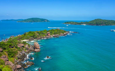 Aerial view of Gam Ghi Phu Quoc island with boats and rocky coastline.