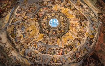 Fresco inside Florence's Duomo dome, depicting religious scenes, part of Accademia Gallery tour.