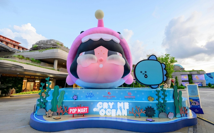 Colorful cartoon display at Singapore Oceanarium entrance featuring marine-themed characters.