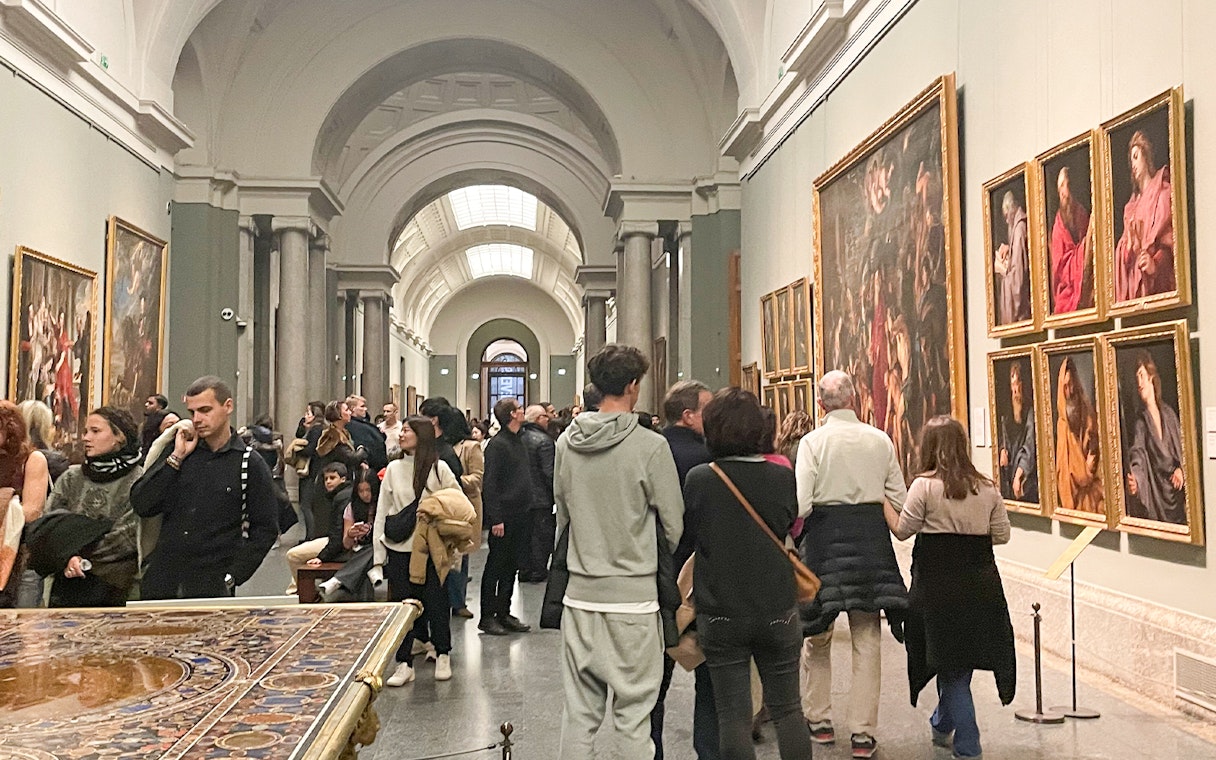 Group tour with guide at Prado Museum exhibition hall, Madrid.