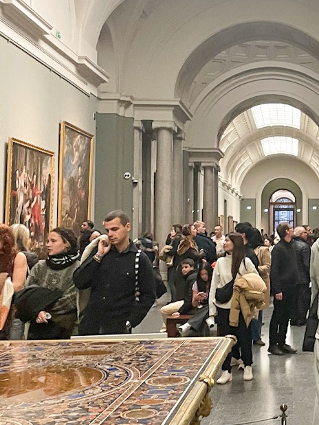 Group tour with guide at Prado Museum exhibition hall, Madrid.
