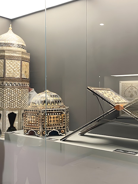 Visitor viewing intricate artifacts at Hagia Sophia Museum, Istanbul.