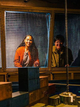 Visitors engaging in an escape room challenge at Prison Island, Brisbane.