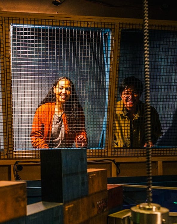 Visitors engaging in an escape room challenge at Prison Island, Brisbane.