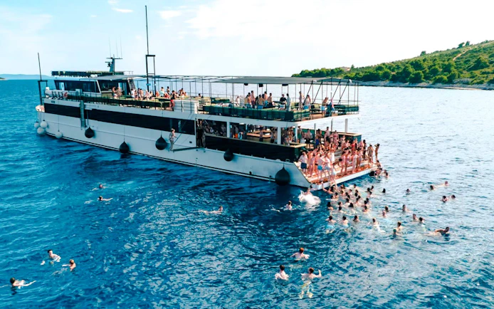 Guests swimming near yacht during Blue Lagoon Party from Split.