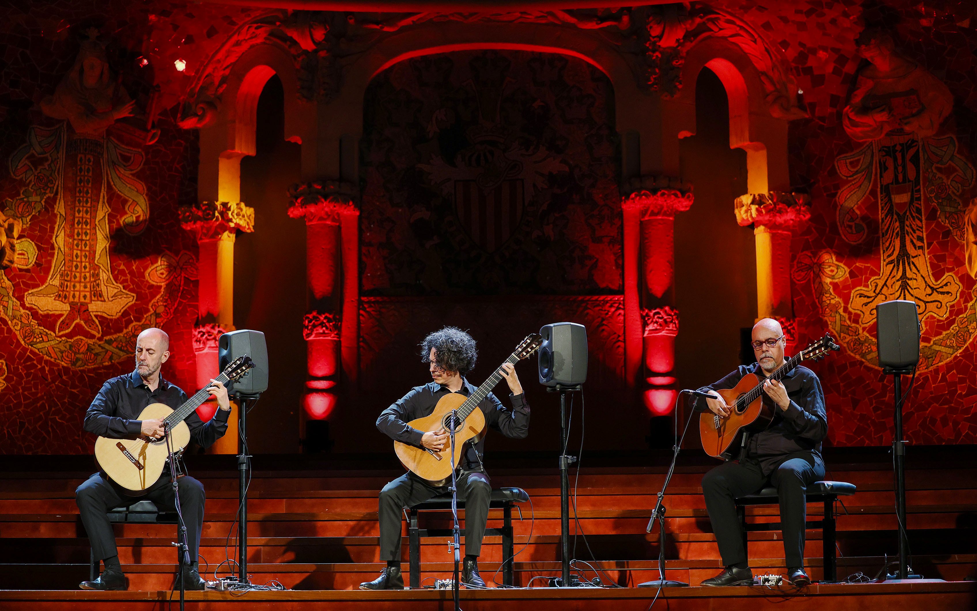 Barcelona Guitar Trio performing on stage with ornate backdrop.