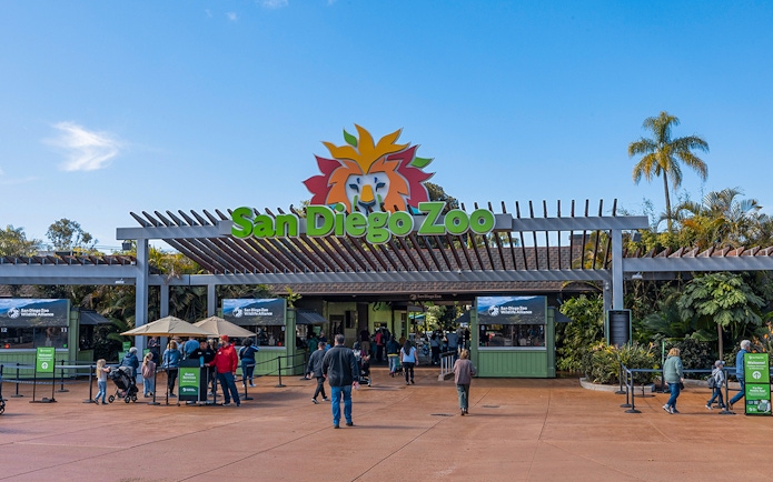 San Diego Zoo entrance with visitors and ticket booths.