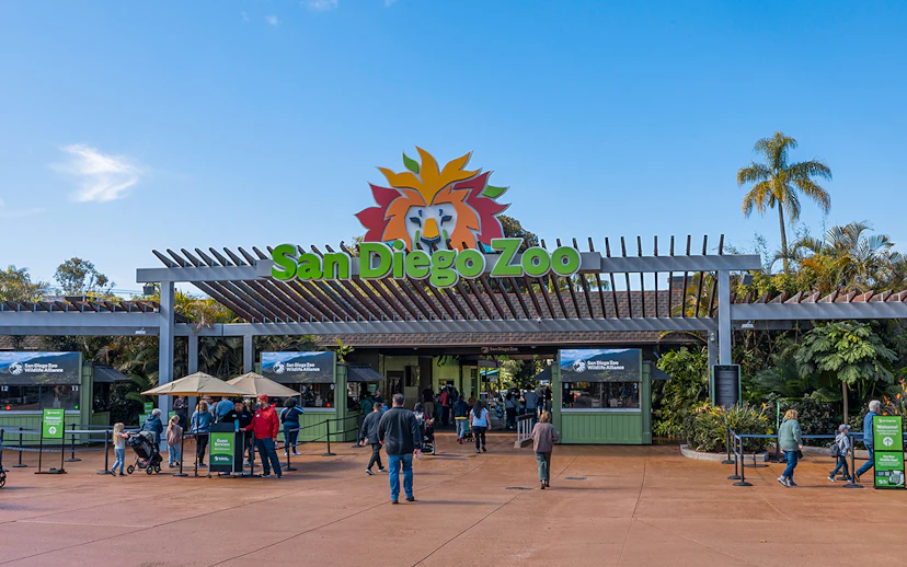 San Diego Zoo entrance with visitors and ticket booths.