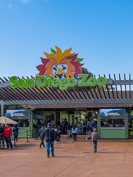 San Diego Zoo entrance with visitors and ticket booths.