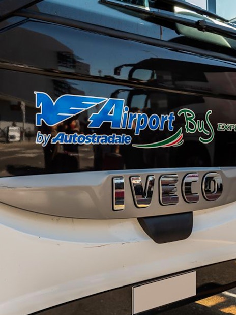 Front view of Autostradale Airport Transfer bus at terminal.