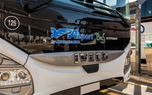 Front view of Autostradale Airport Transfer bus at terminal.