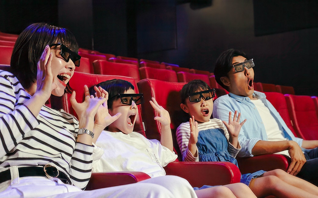 Family enjoying 4D cinema experience at LEGOLAND Discovery Center Osaka.