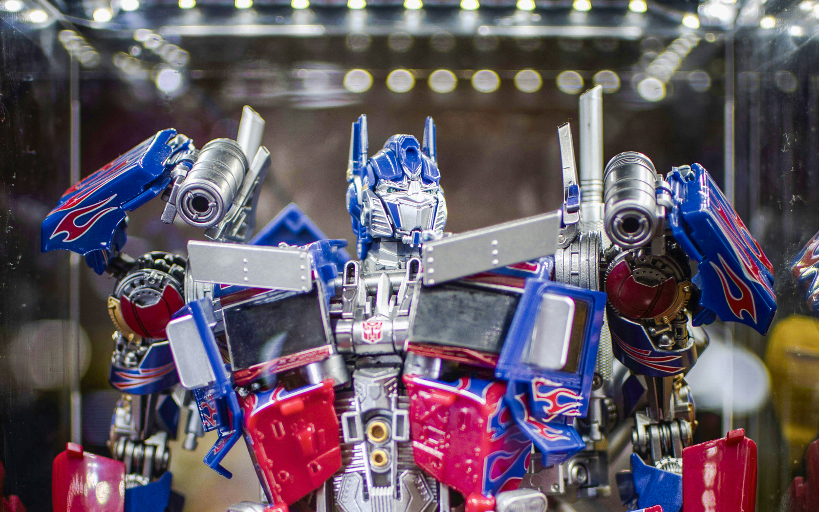 Transformers action figures displayed in a dynamic battle scene.
