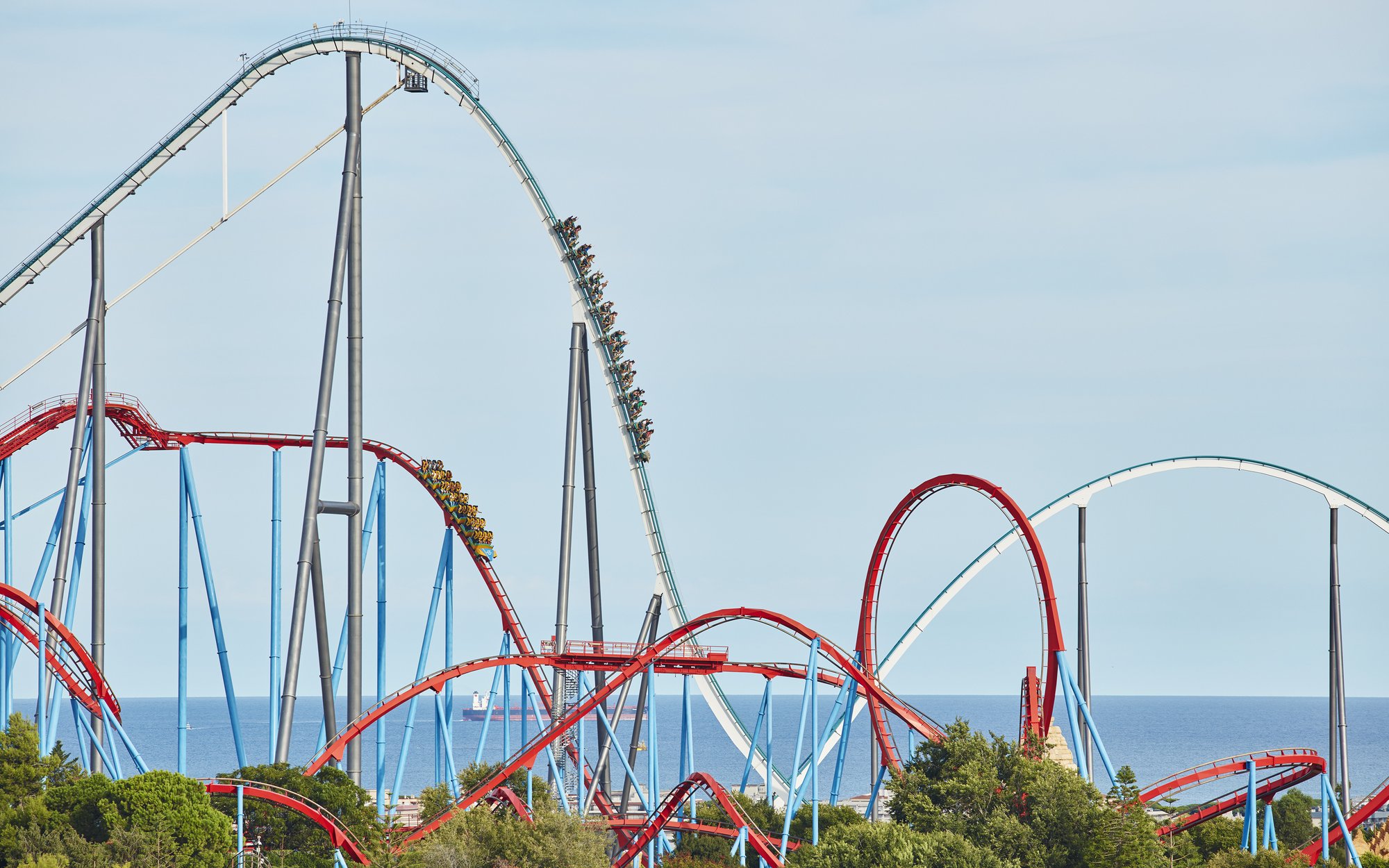 Shambhala roller coaster at PortAventura with ocean backdrop.
