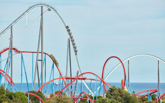 Shambhala roller coaster at PortAventura with ocean backdrop.