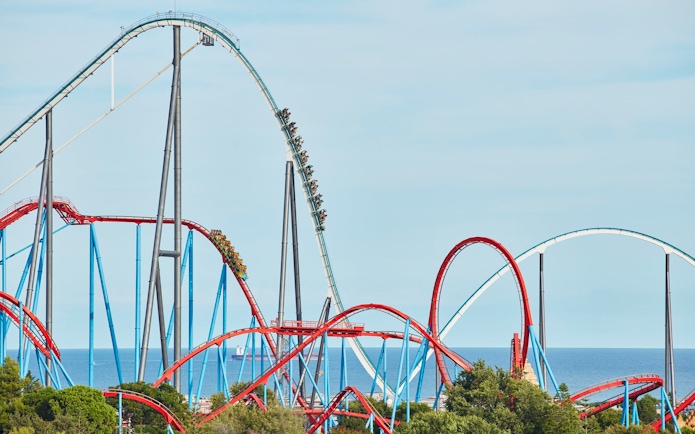 Shambhala roller coaster at PortAventura with ocean backdrop.