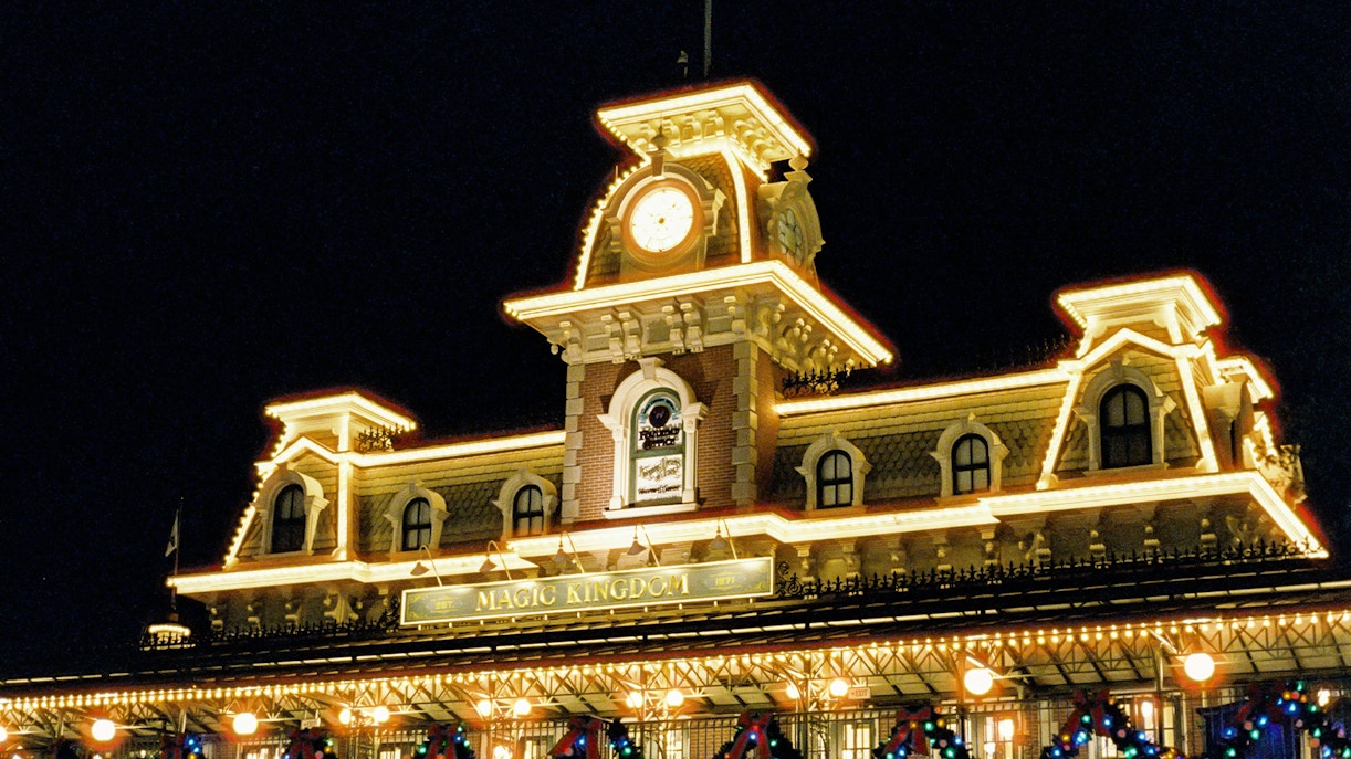 Magic Kingdom entrance illuminated at night, Walt Disney Resort, Orlando.