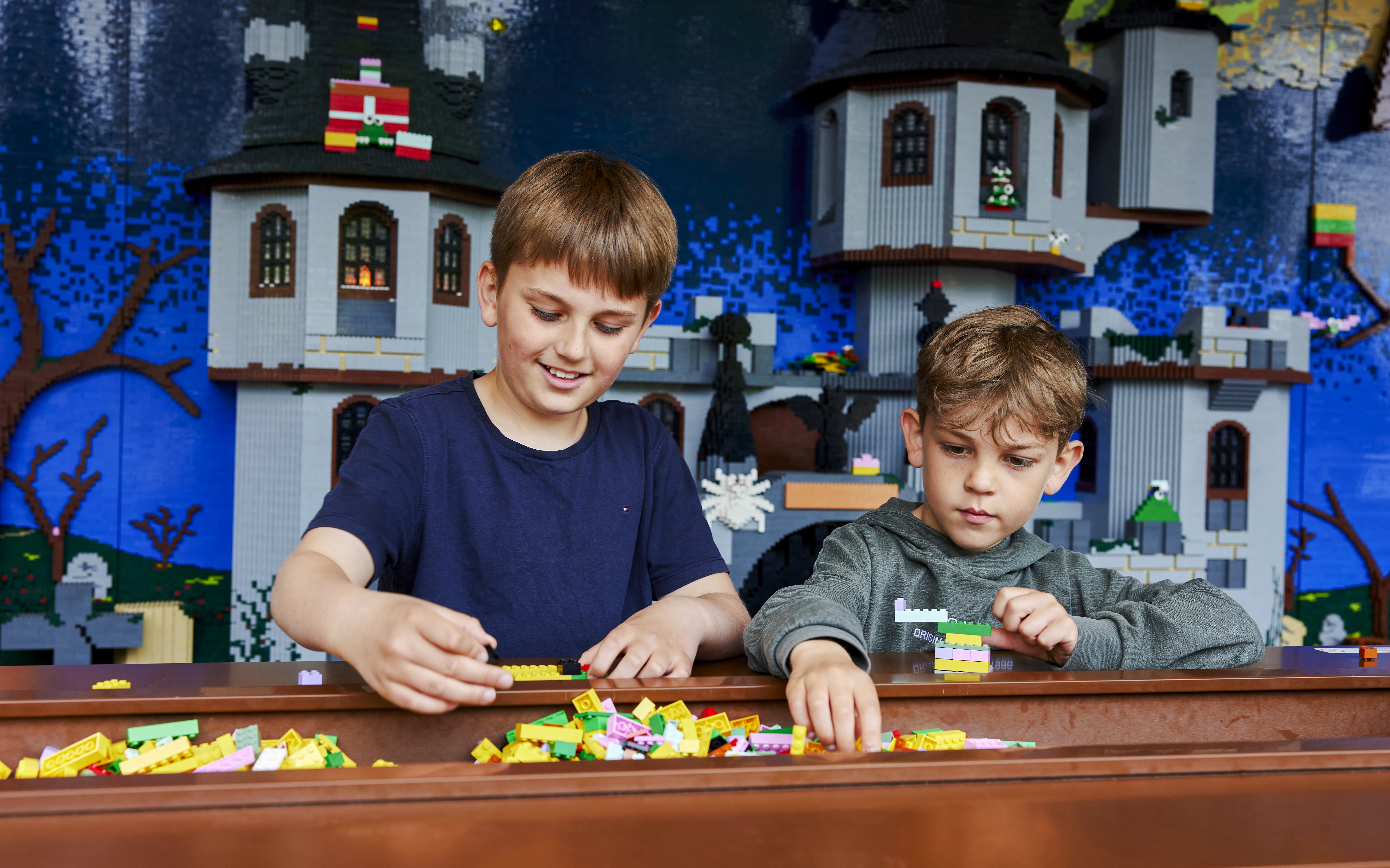 Children building with LEGO bricks at LEGOLAND Billund.