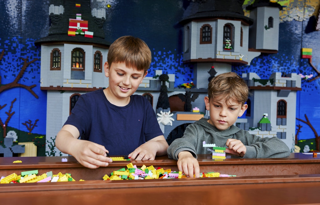 Children building with LEGO bricks at LEGOLAND Billund.