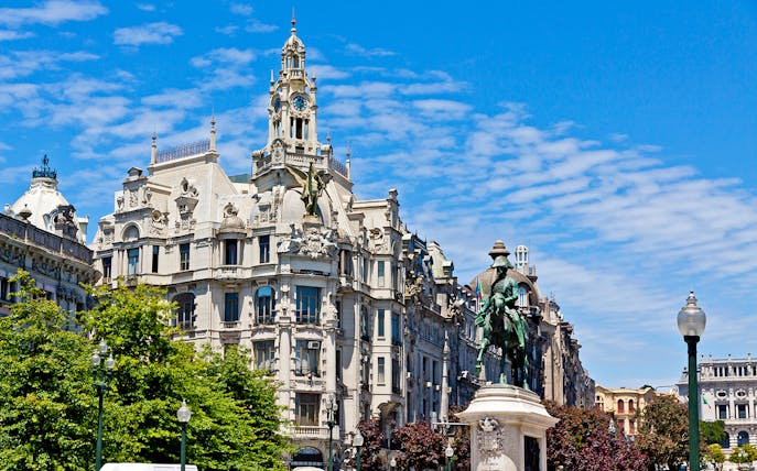 Porto's Avenida dos Aliados with equestrian statue and historic architecture.