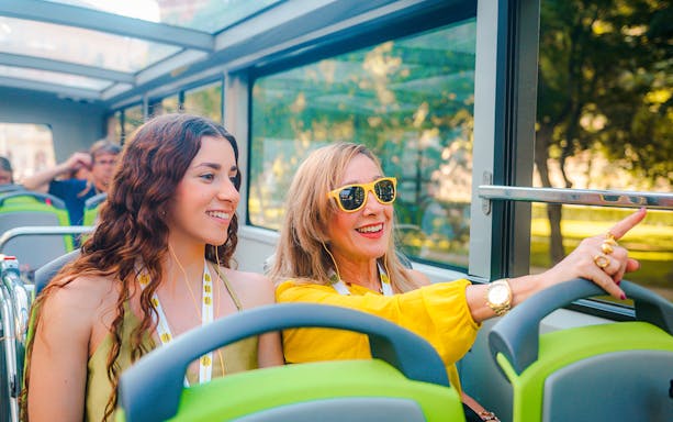 Tourists enjoying a Vienna sightseeing bus tour.