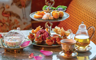 Assorted Thai desserts and tea set at Akara Sky restaurant.