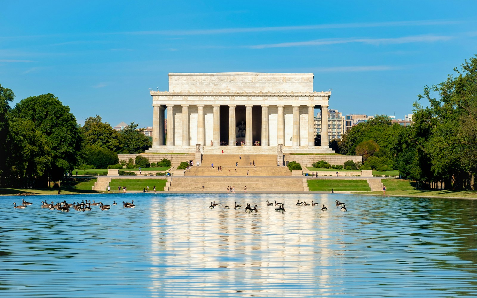 Lincoln Memorial in Washington DC with tourists exploring the iconic monument.