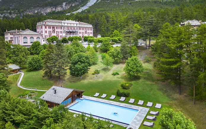 QC Terme Bagni Nuovi di Bormio spa with outdoor pool and surrounding gardens.
