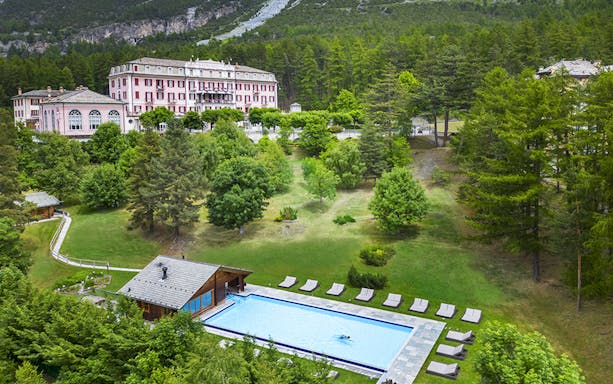 QC Terme Bagni Nuovi di Bormio spa with outdoor pool and surrounding gardens.
