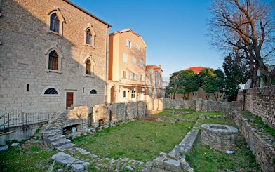 Historic stone buildings and ancient ruins in Kotor, Montenegro.