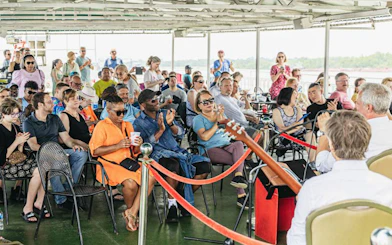 Guests enjoying live jazz music on a riverboat cruise in New Orleans.