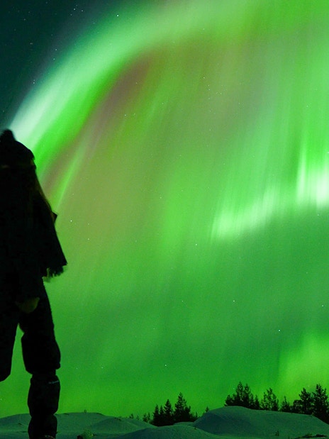 Guest viewing Northern Lights on tour with unlimited mileage and photography.