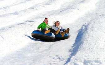 People snow tubing at Farellones Park, Santiago.