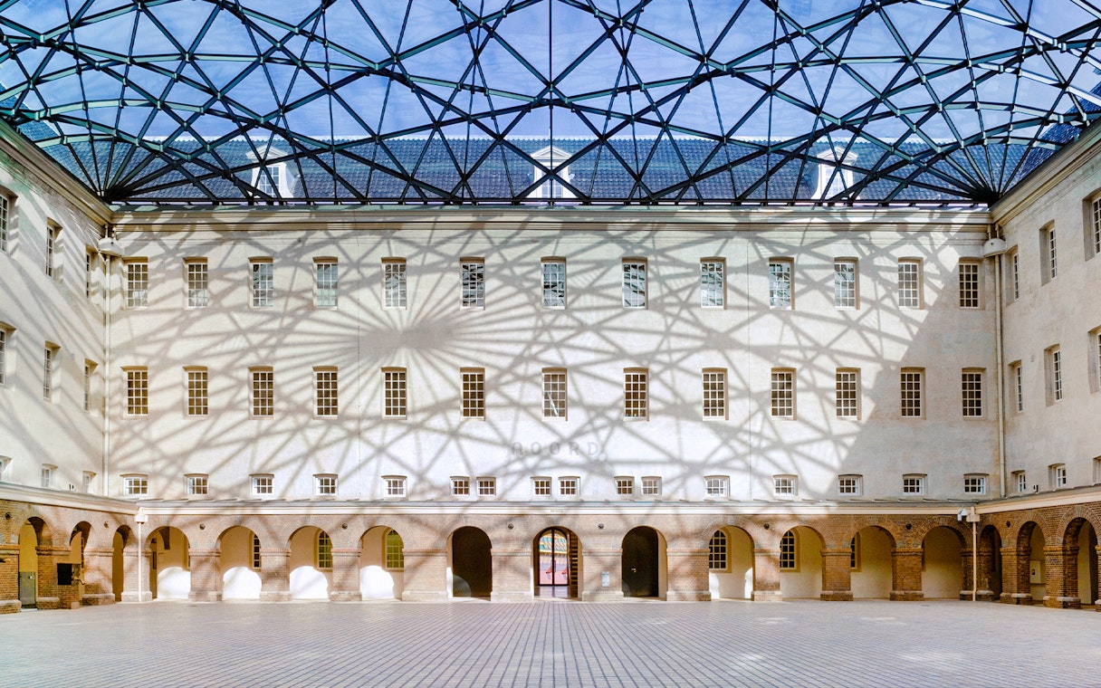 Skylight casting shadows inside The Maritime Museum courtyard, Amsterdam.